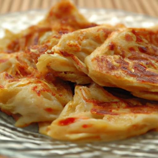 Roti Canai: The Flaky Delight⁤ from Malaysia's Streets