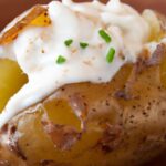 The Classic Comfort: Baked Potato Topped with Sour Cream