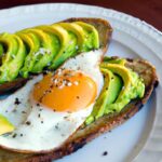 Golden Delight: Avocado Toast Topped with a Fried Egg